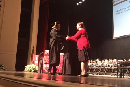 Graduate shaking hands with Director